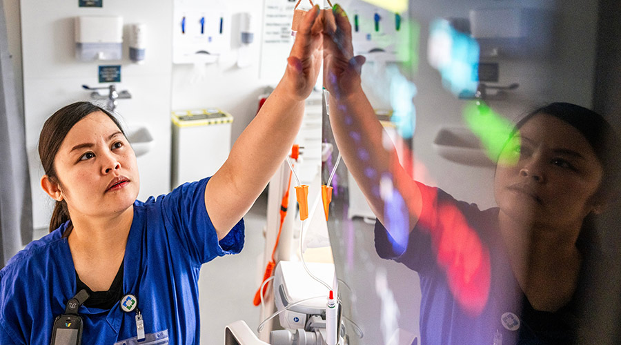 A Cleveland Clinic Caregiver looking at a screen.