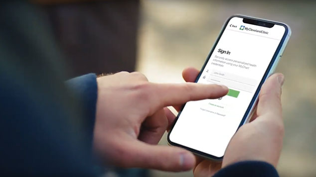 A person looking at MyChart on their smart phone.