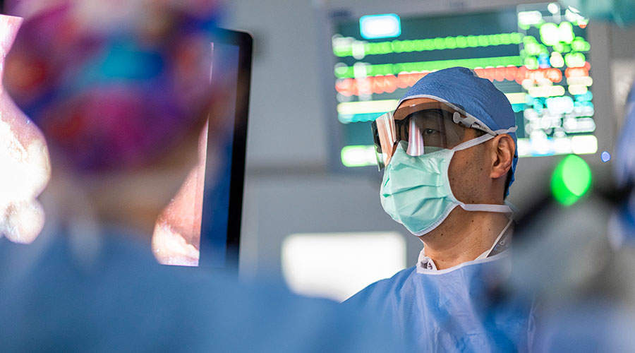 Surgeons performing digestive surgery in the operating room.