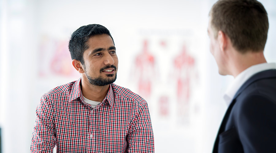 Cleveland Clinic London caregiver and patient having a conversation.