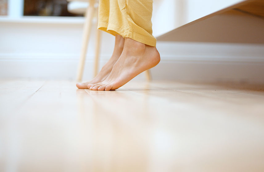 Feet starting to touch the floor from getting out of bed.