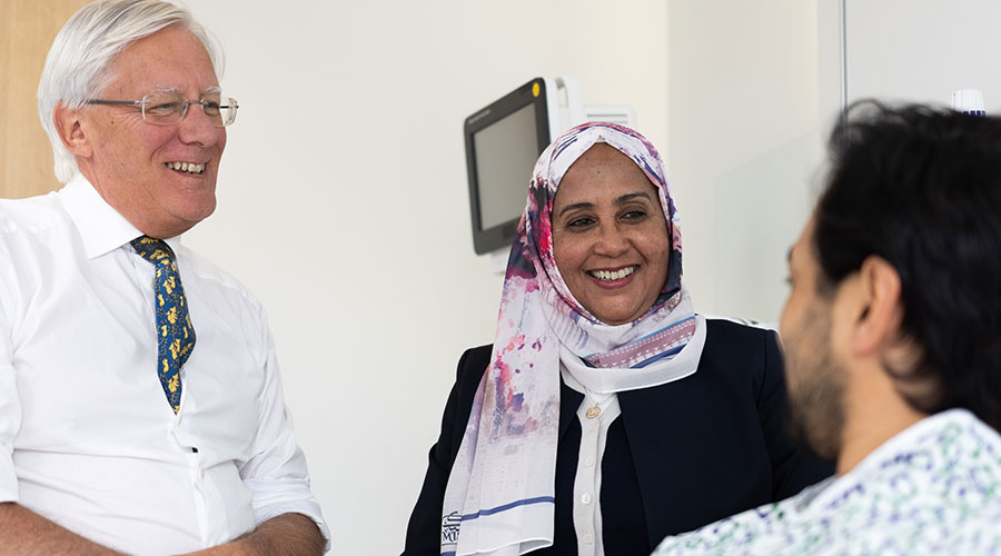 Cleveland Clinic consultants going over hip revision options with a patient.