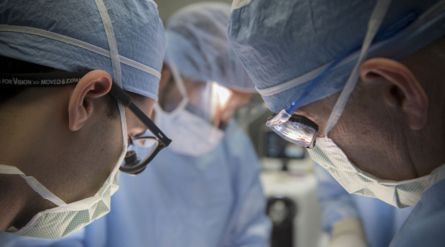 Surgeons performing trauma surgery